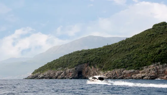 Sweeping view of the Bay of Kotor fjord-like coastline framed by limestone mountains, ideal for a private yacht cruise from Montenegro to Dubrovnik