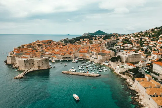 Marble-paved Stradun main street of Dubrovnik Old Town lined with baroque buildings and lively pedestrians, Croatia