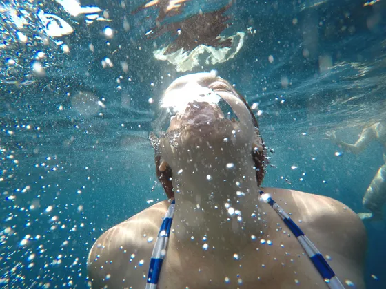 Snorkeling stop on Private Blue Cave Tour Dubrovnik in clear Adriatic cave waters