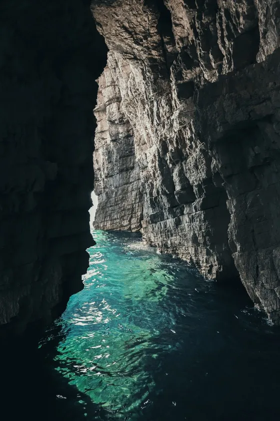 Stunning turquoise waters inside a Dubrovnik sea cave.