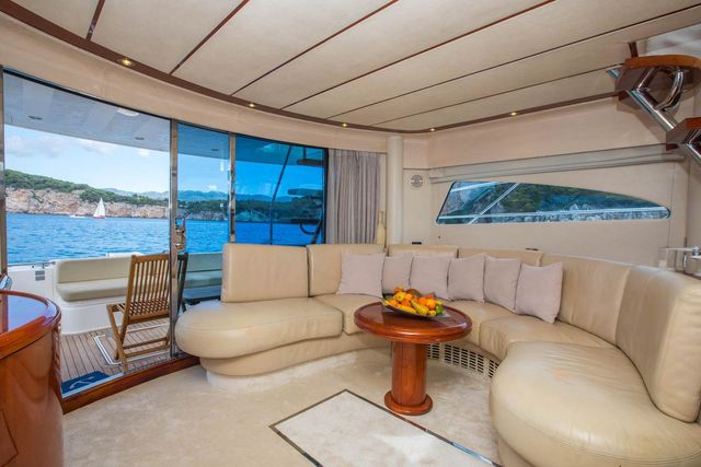 Luxurious yacht interior with panoramic sea view, comfortable seating area, and elegant furnishings for a premium Dubrovnik cruise experience.
